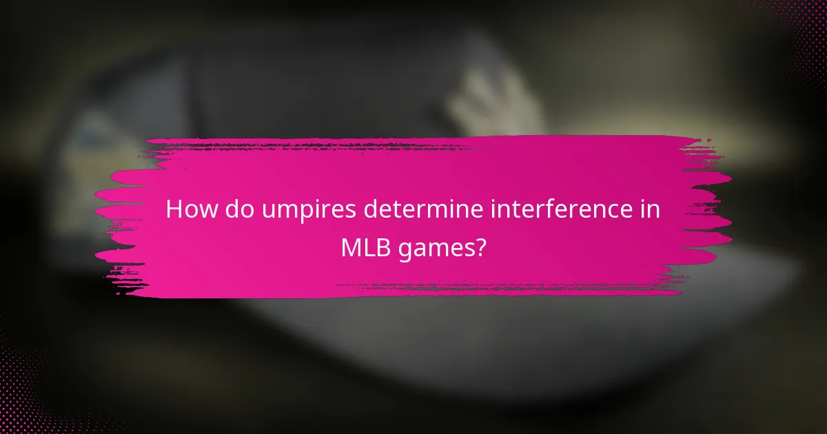 How do umpires determine interference in MLB games?