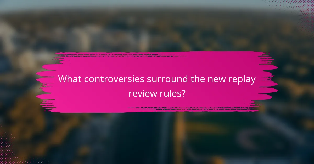 What controversies surround the new replay review rules?